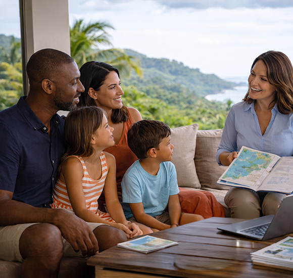 family meeting with advisor in Costa Rica discussing relocation and lifestyle options with map and ocean view